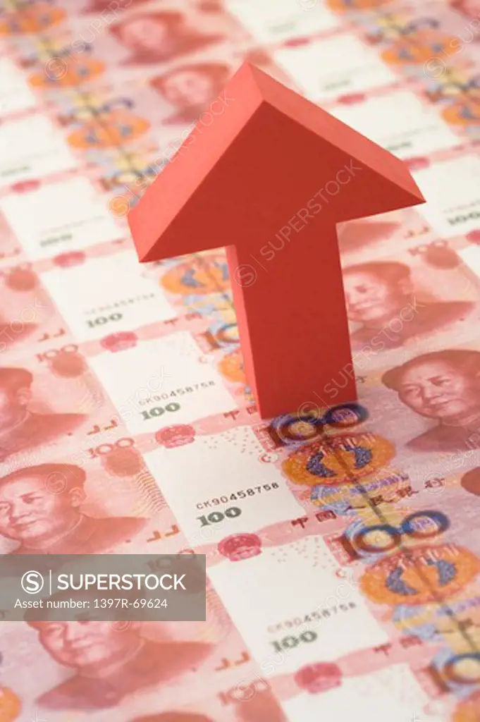 A arrow sign pointing up on China Currency
