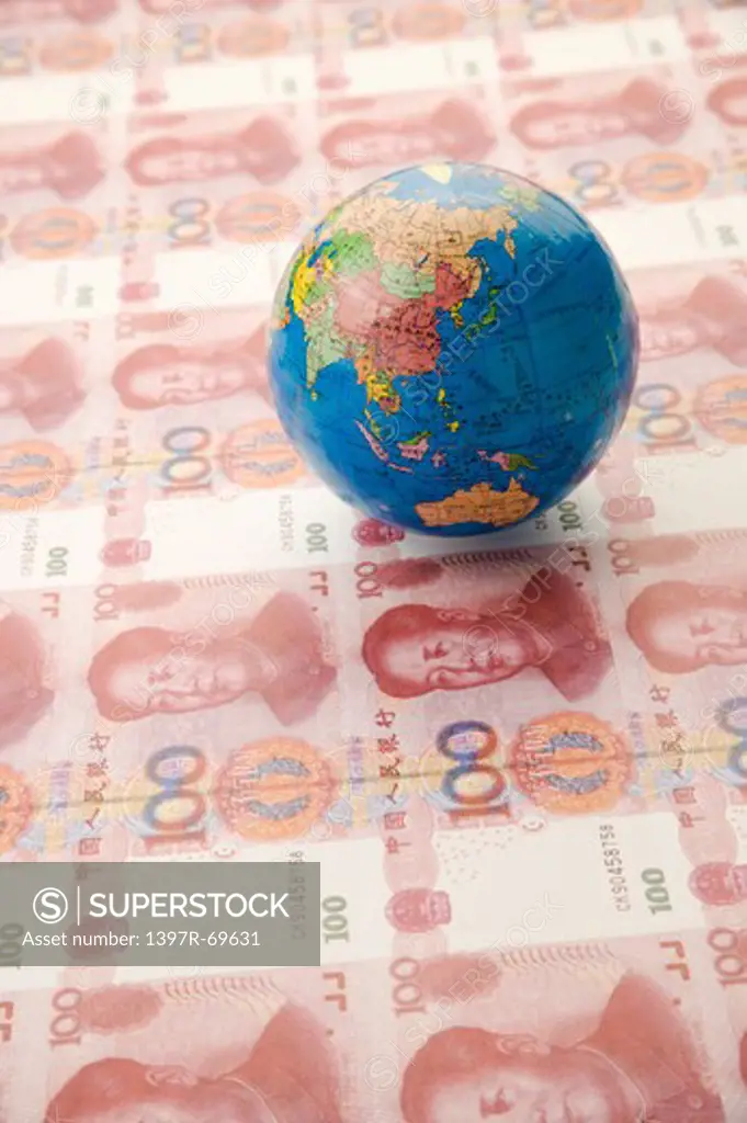 China Currency and a globe of world map