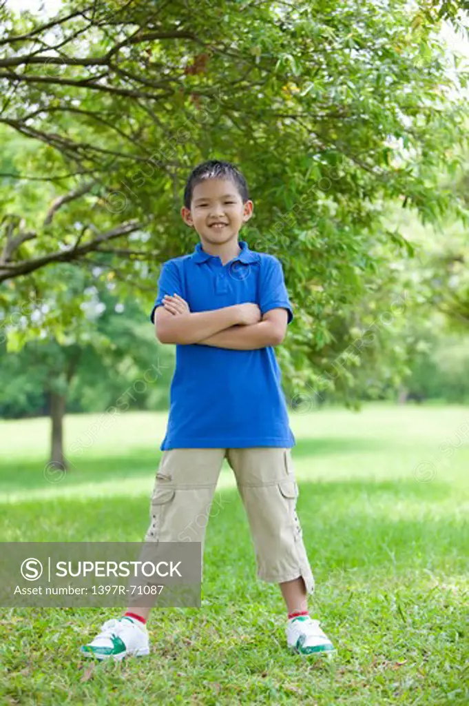 Boy standing in a park