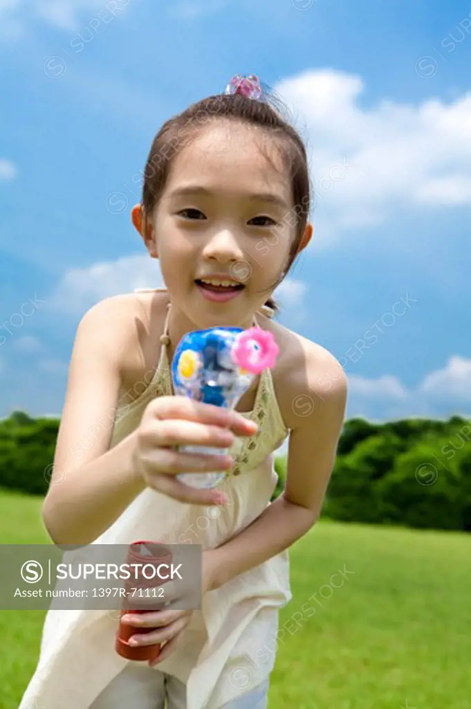 Girl showing toy