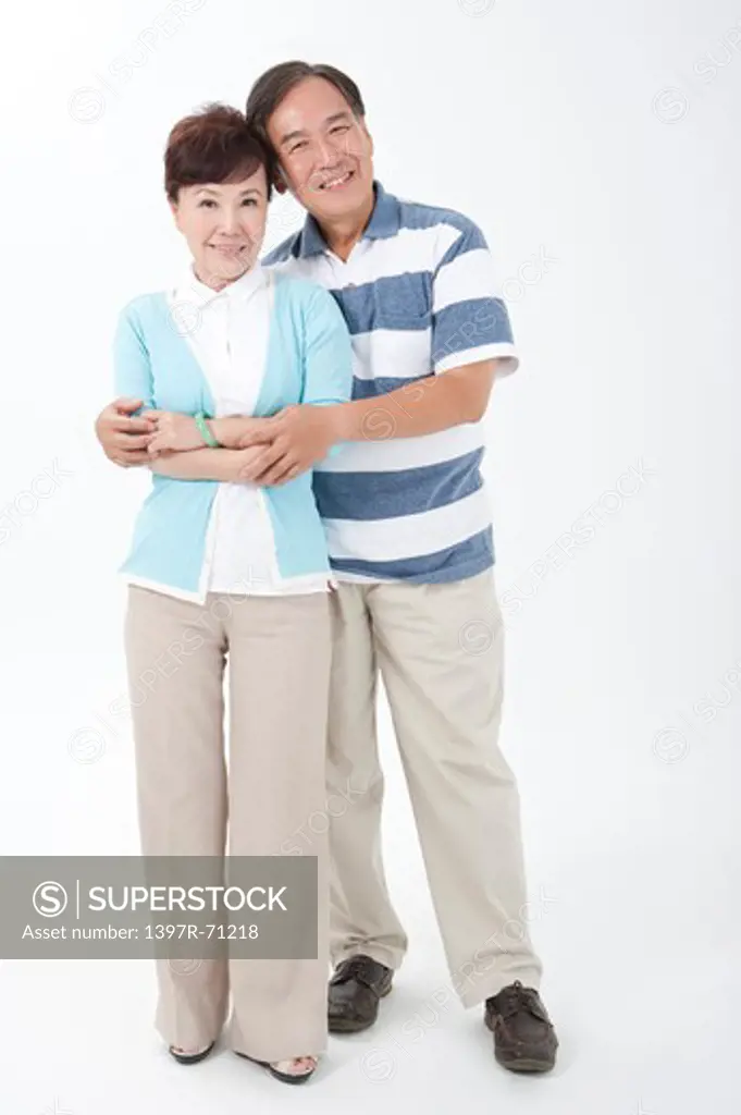 Portrait of senior couple standing together and smiling