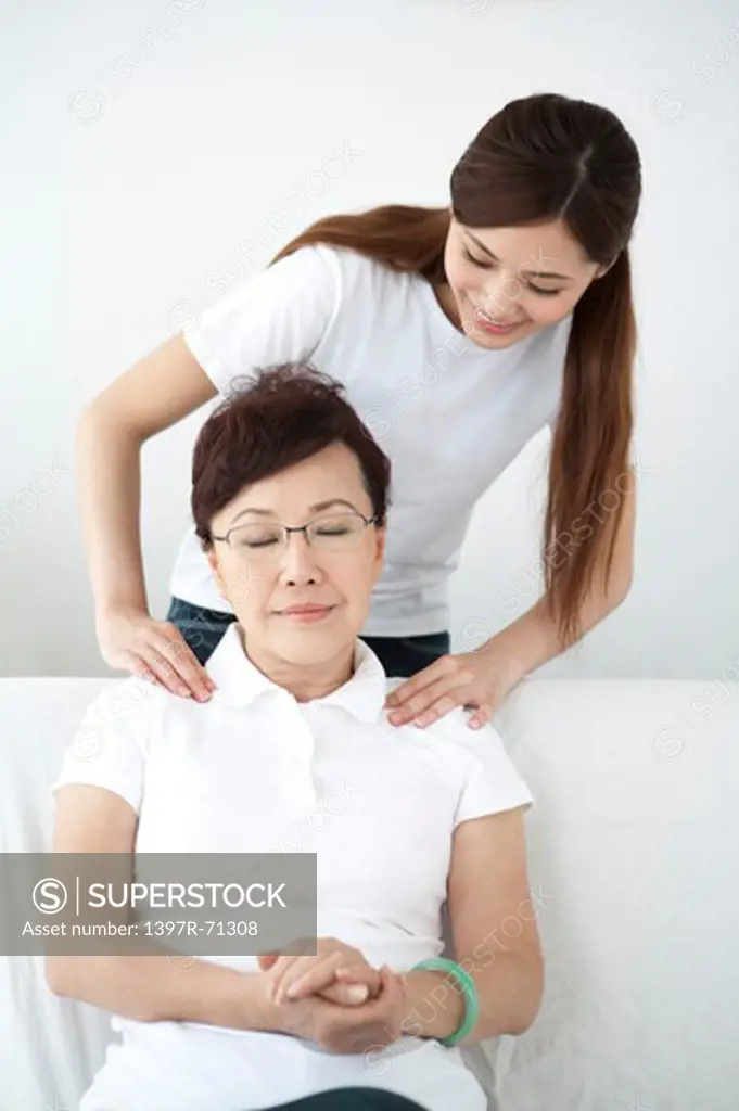 Daughter massaging for her mother