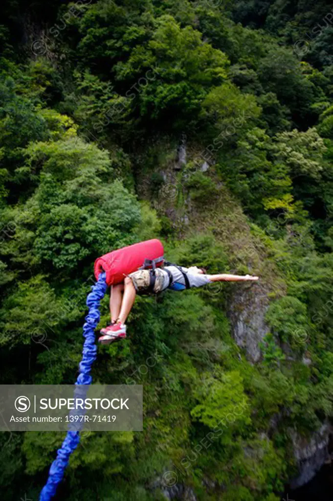 Man bungee jumping