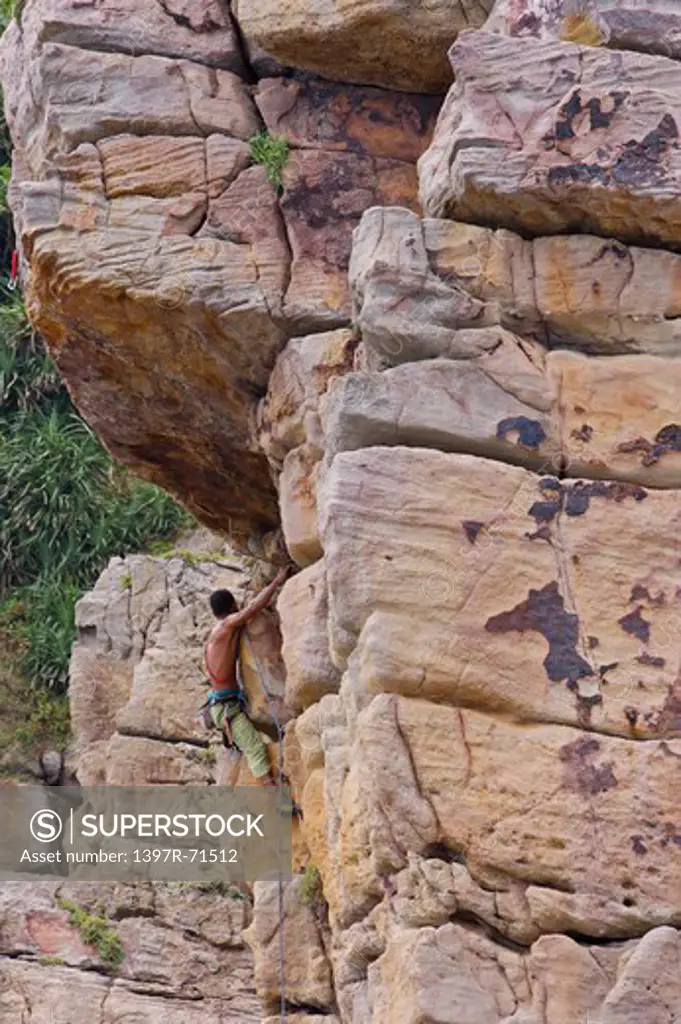Man rock climbing on cliffs