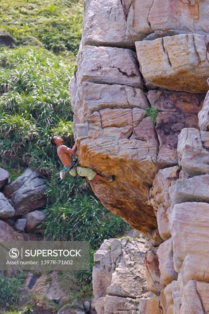 Man rock climbing on cliffs