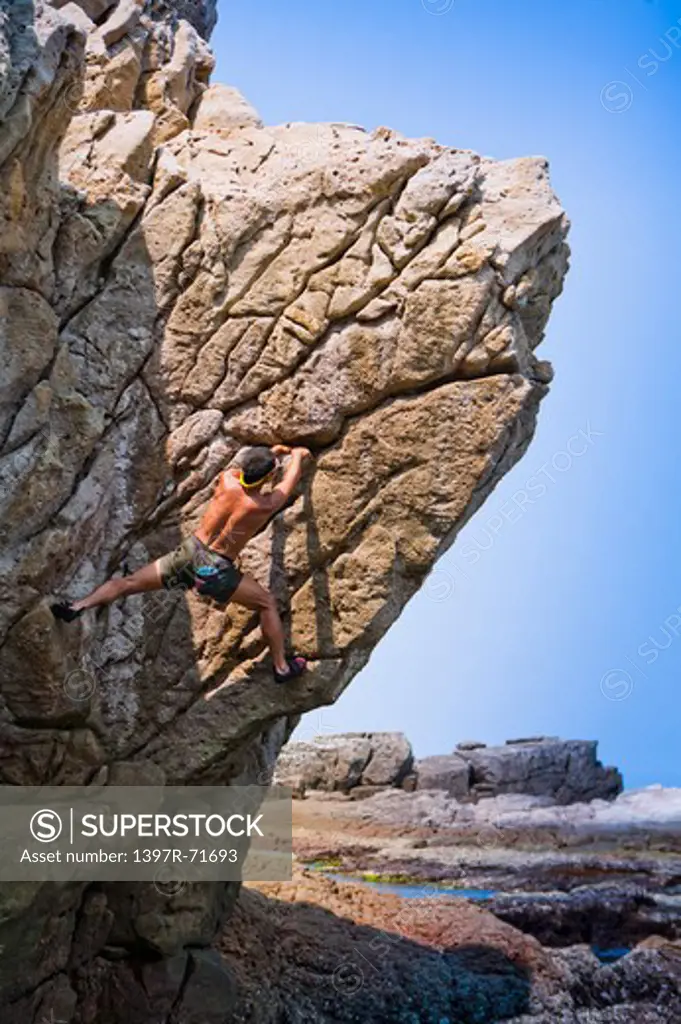 Mature man climbing on the cliff, Rock Climbing, Extreme Sports