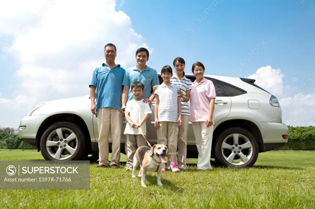 Multi-generational family going for an outing with their pet