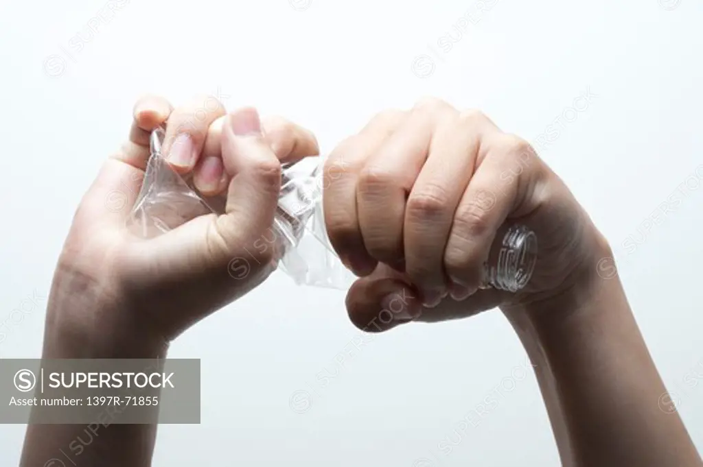 Man twisting a plastic bottle