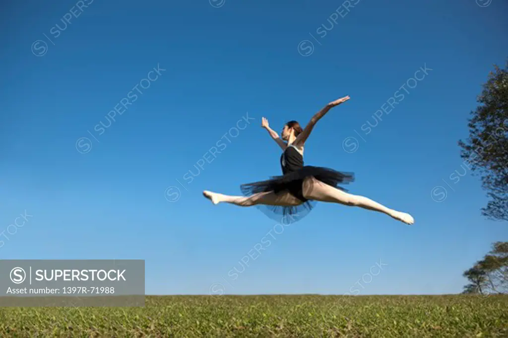 Ballet dancer dancing in mid-air