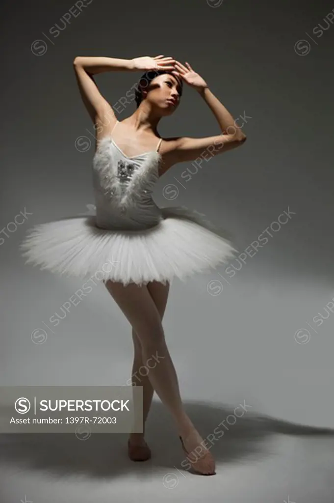 Ballet dancer dancing and looking away
