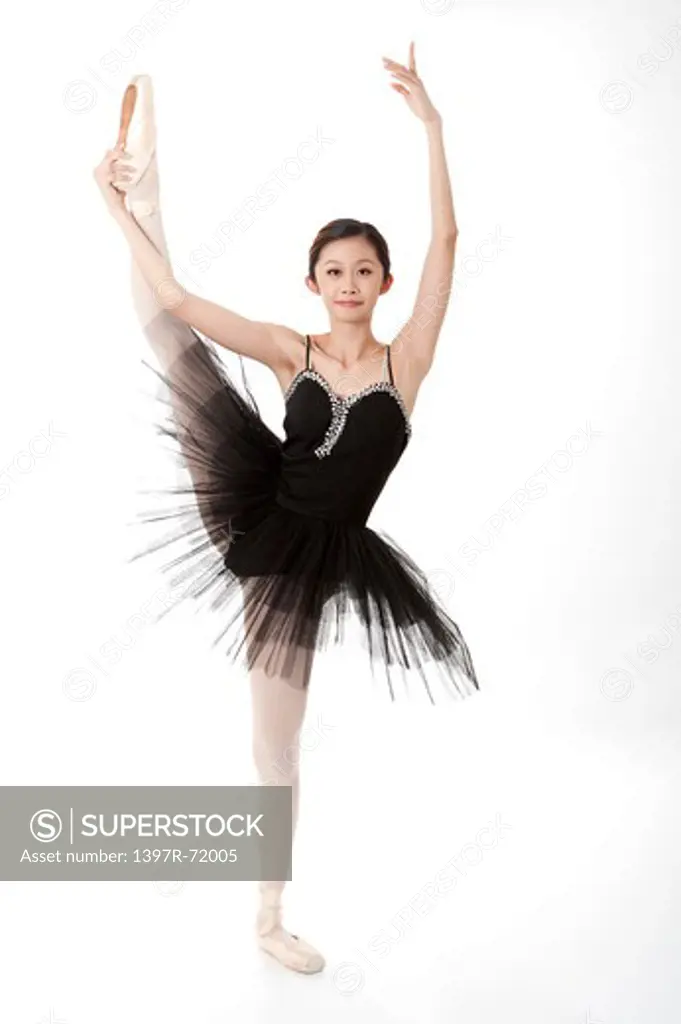 Ballet dancer dancing and looking at the camera