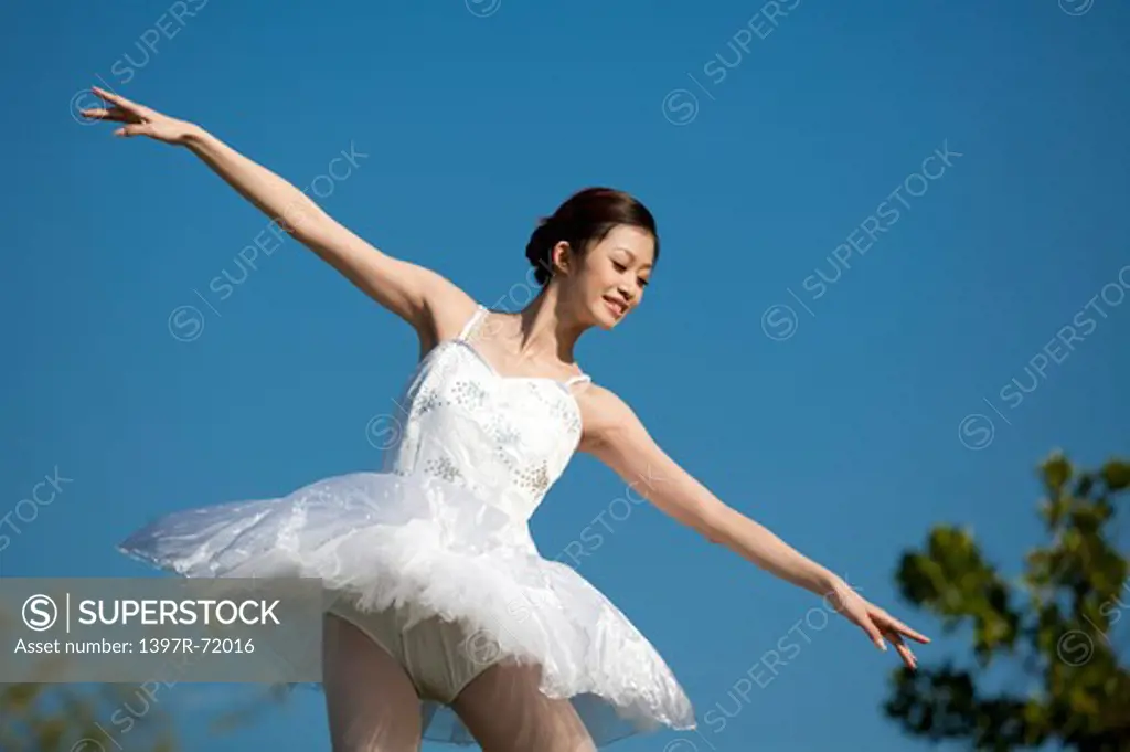Ballet dancer dancing and looking down