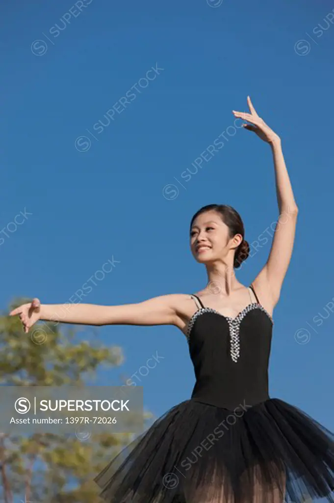 Ballet dancer dancing with smile