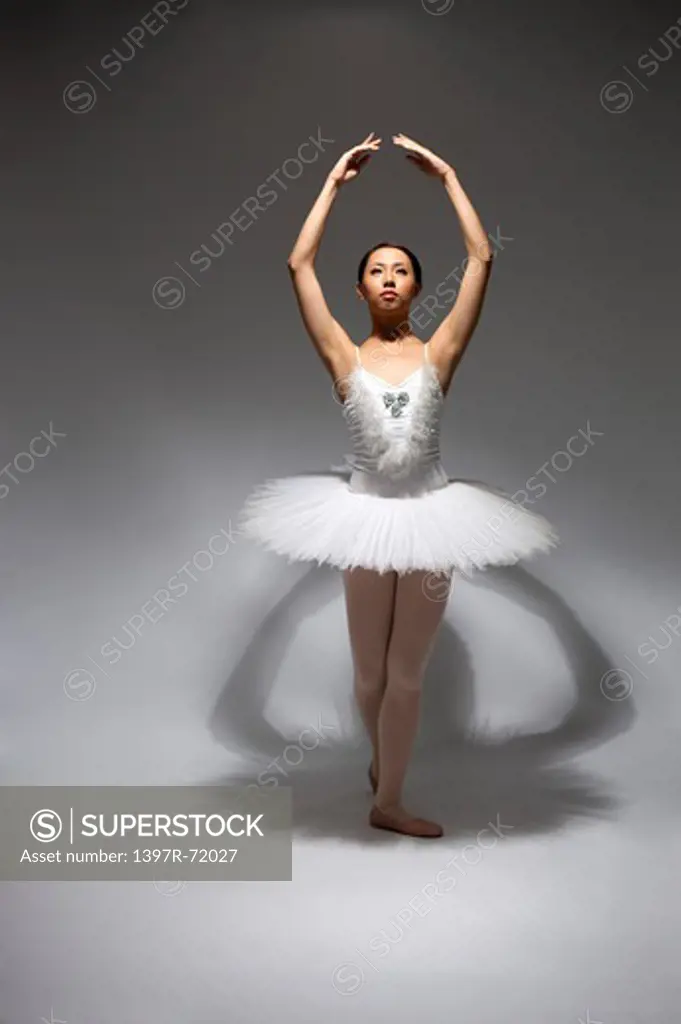 Ballet dancer dancing and looking up