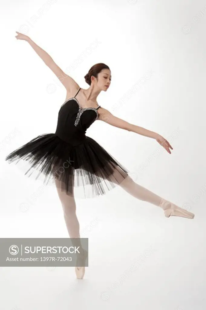 Ballet dancer dancing and looking down