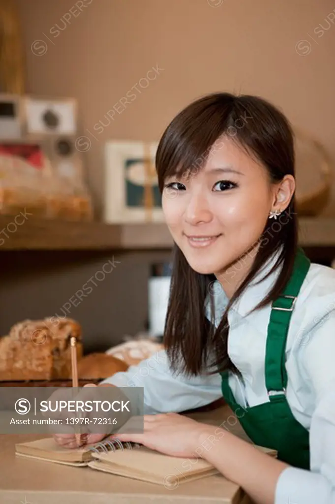 Female baker accounting