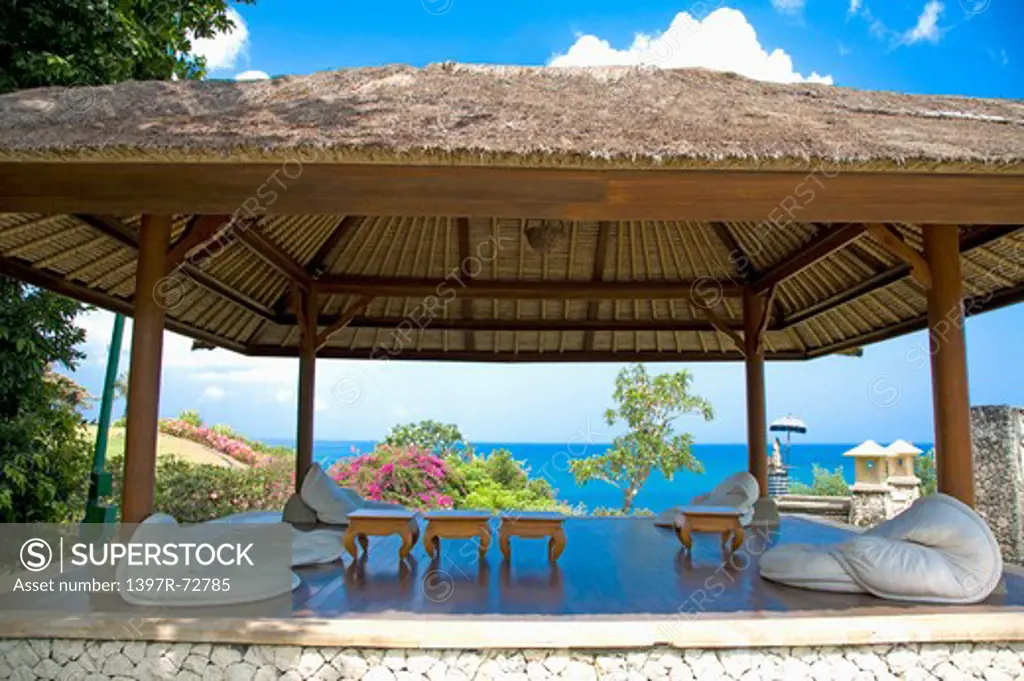 Bali, a thatched-roof pavilion by sea