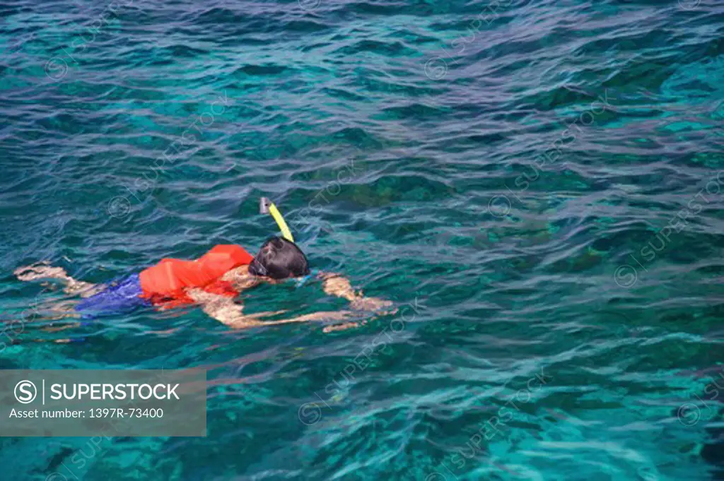 Caogahan Island, Cebu, Philippines, Asia, Man swimming in the sea