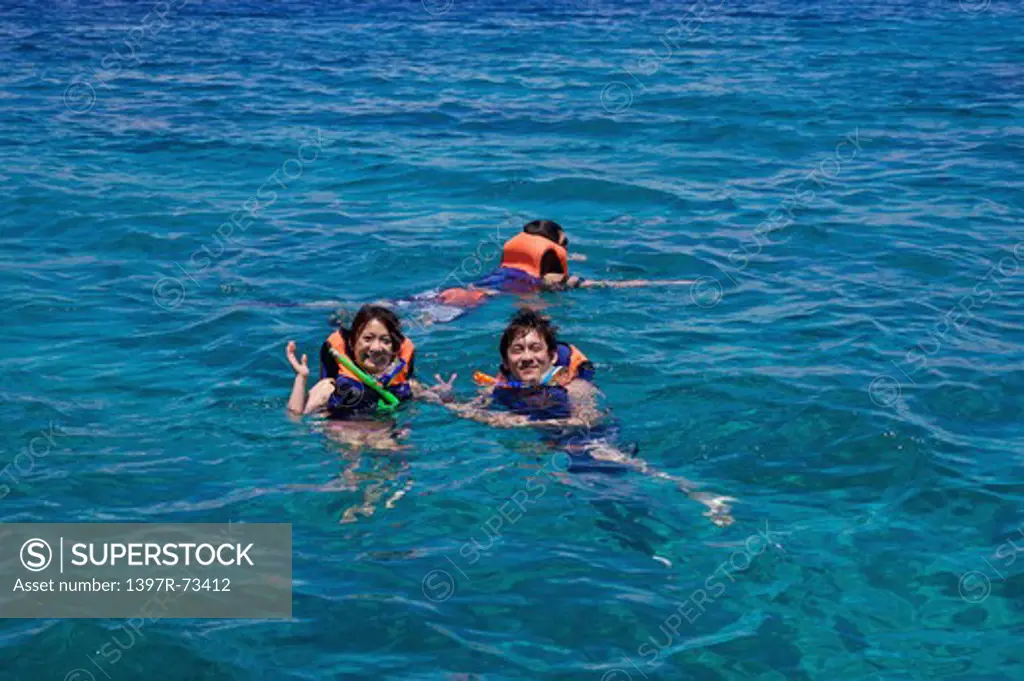 Caogahan Island, Cebu, Philippines, Asia, Three people scuba diving together