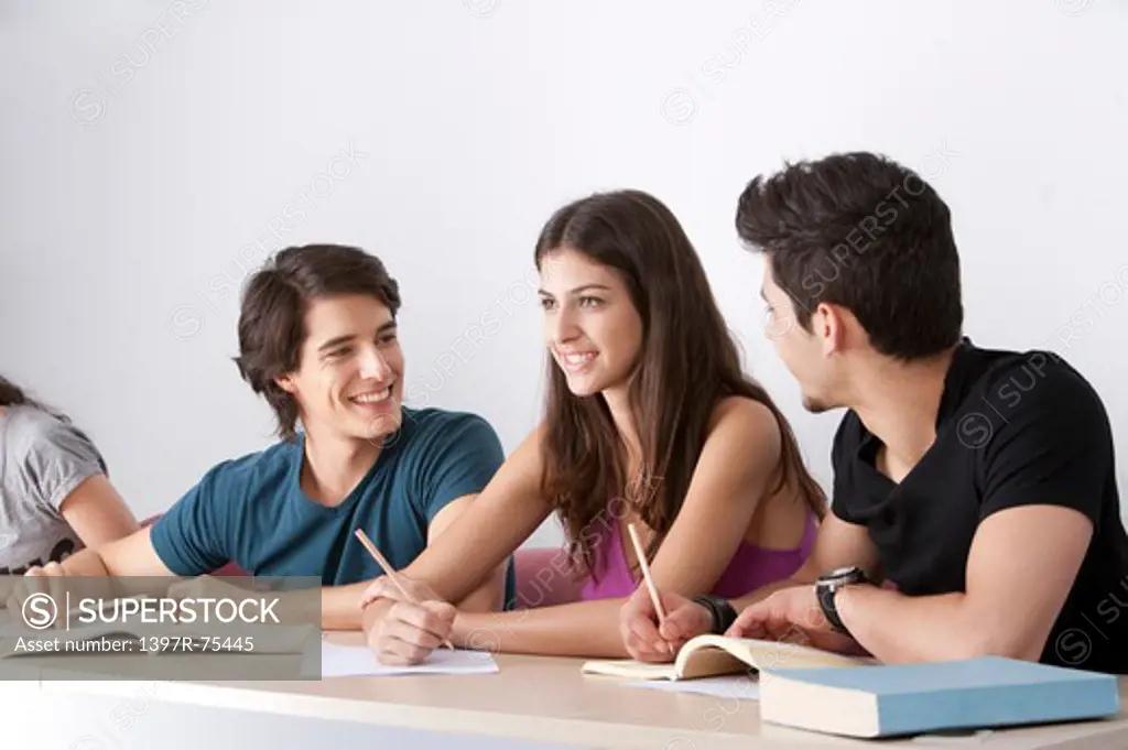 Students sitting in classroom, smiling