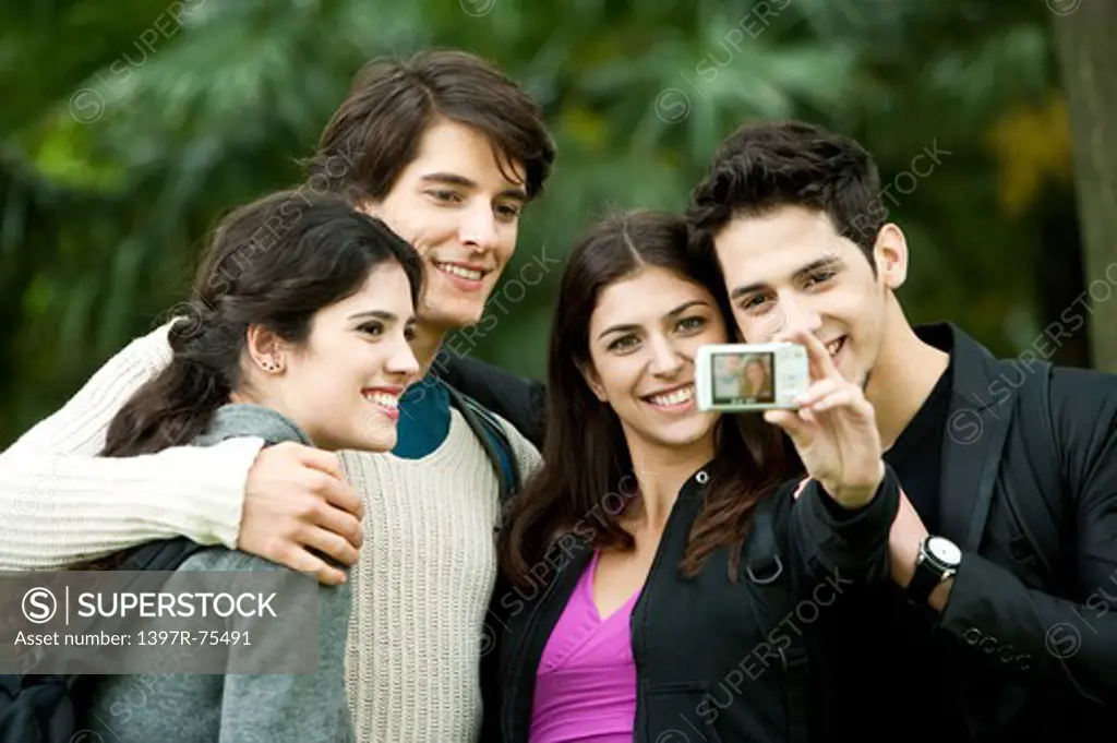 Four young friends taking self-portrait