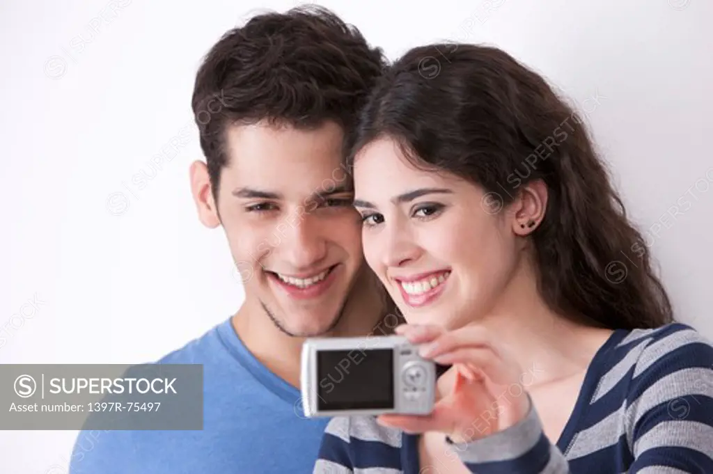Young couple taking self-portrait