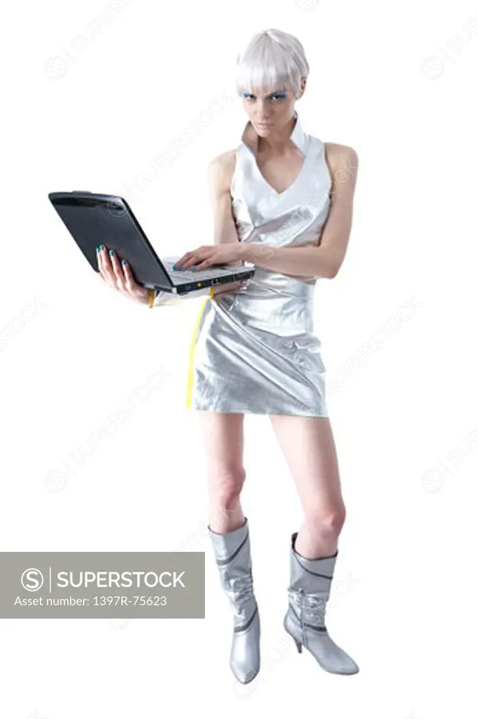 Young woman using laptop and looking at the camera