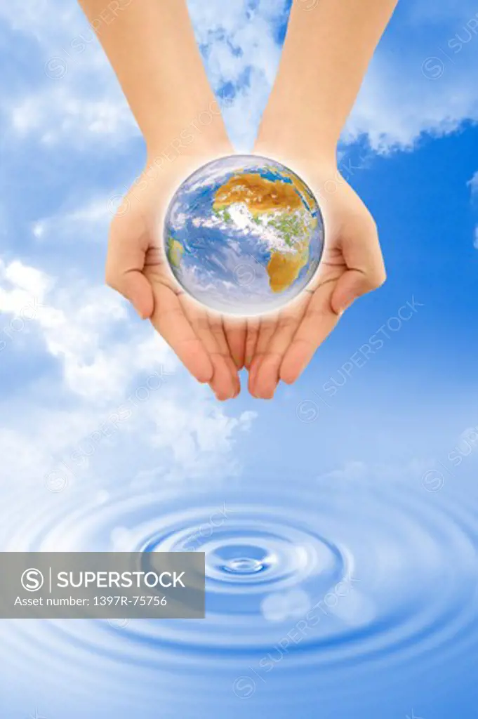 Environmental Conservation, Digitally generated image of human hands holding the earth