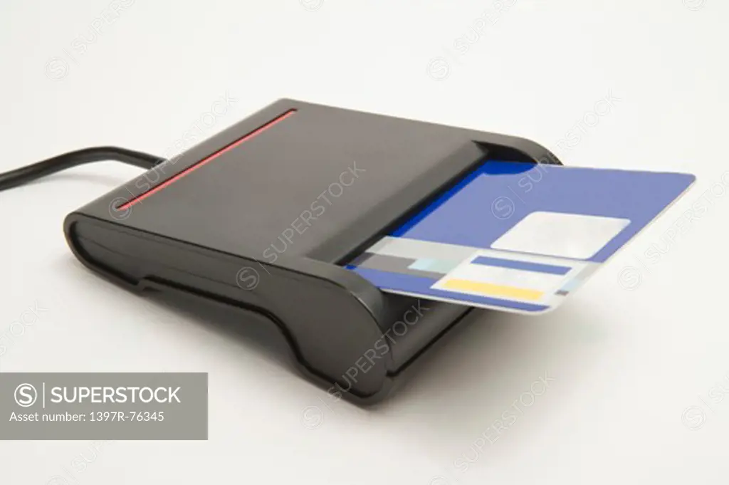 Close-up of a credit card in the slot of a memory card reader