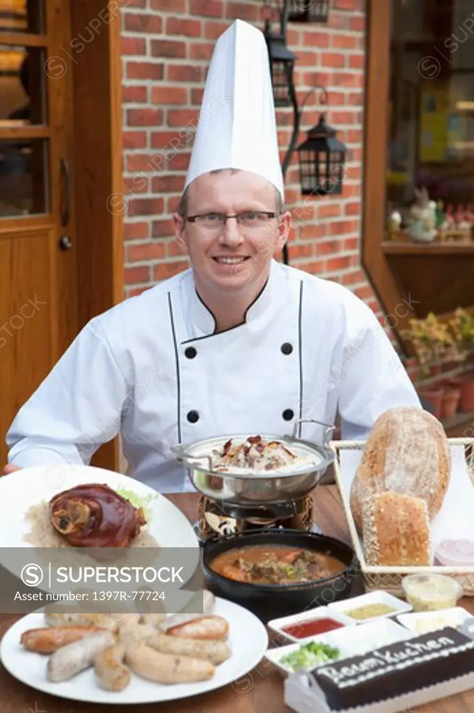 Chef with various kinds of German food