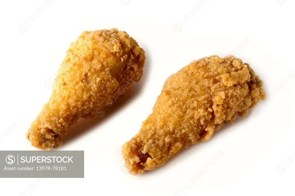 Close-up of two fried chicken legs