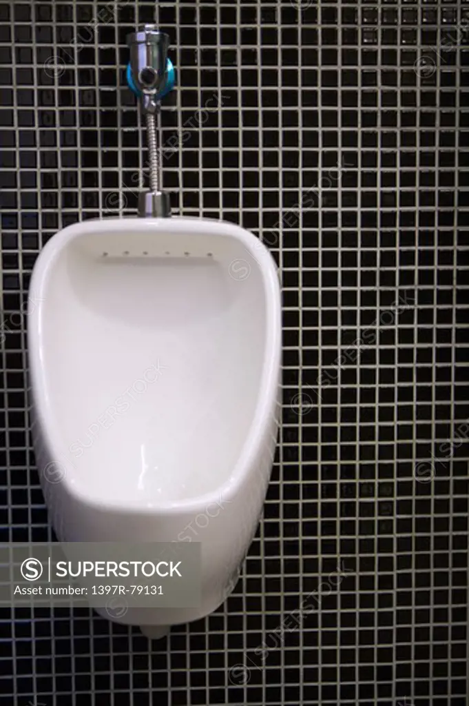 Urinal in modern bathroom