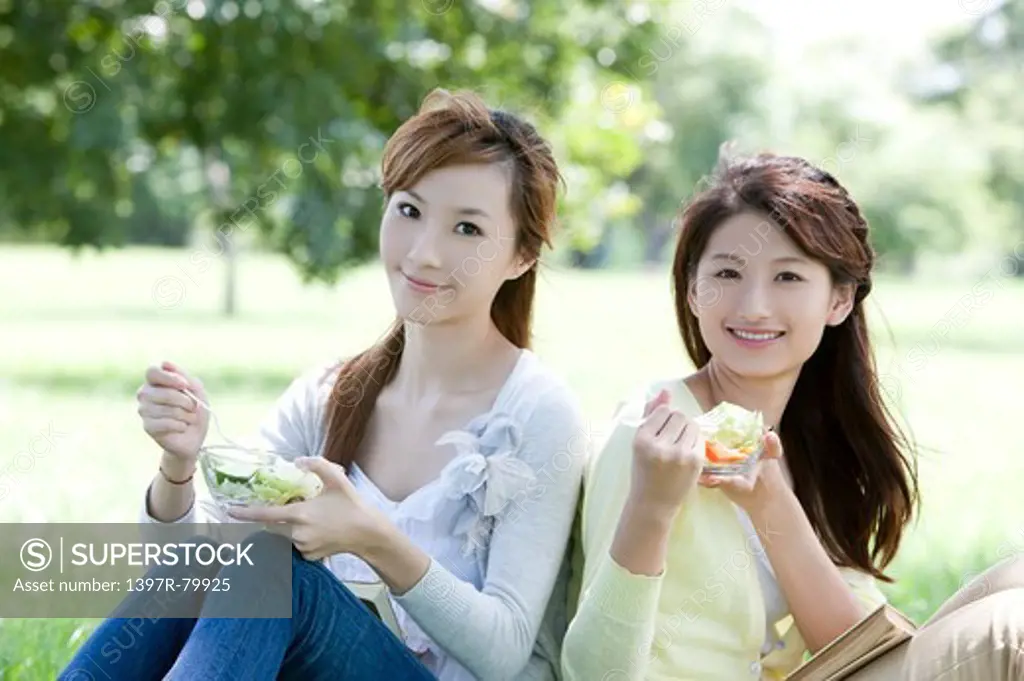 Young women smiling at the camera