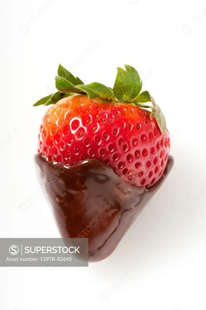 Close-up of strawberry with chocolate sauce