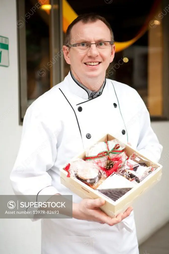 Close-up of man holding a box of German food