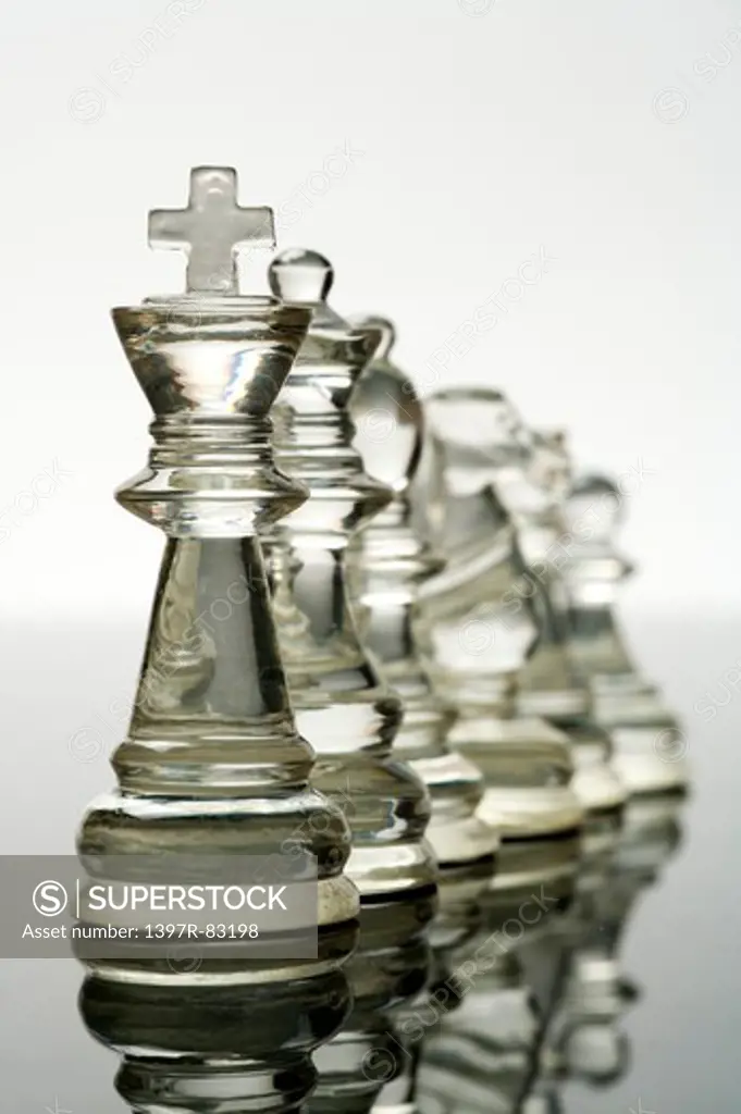 Close-up of chess standing in a row