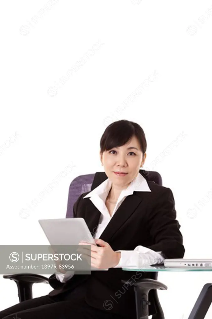 Businesswoman holding pad and smiling at the camera