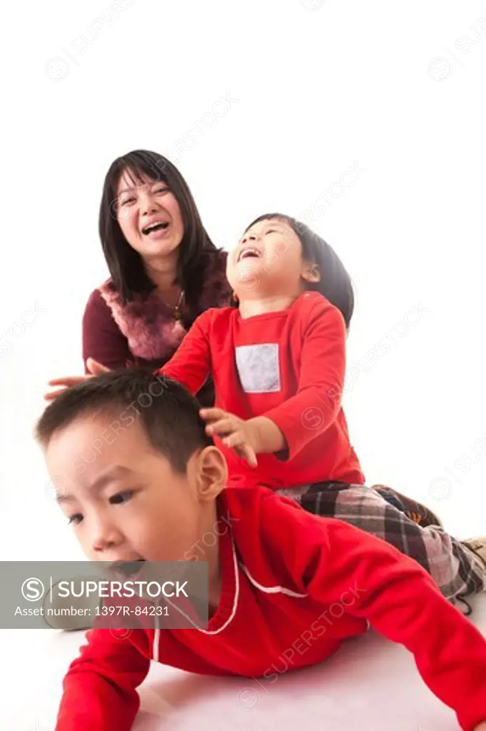 Family with two children smiling happily together