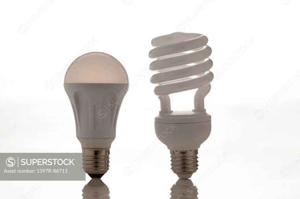 Normal light bulb versus energy saving light bulb