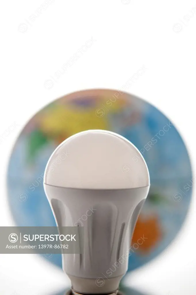 Light bulb with globe in the background