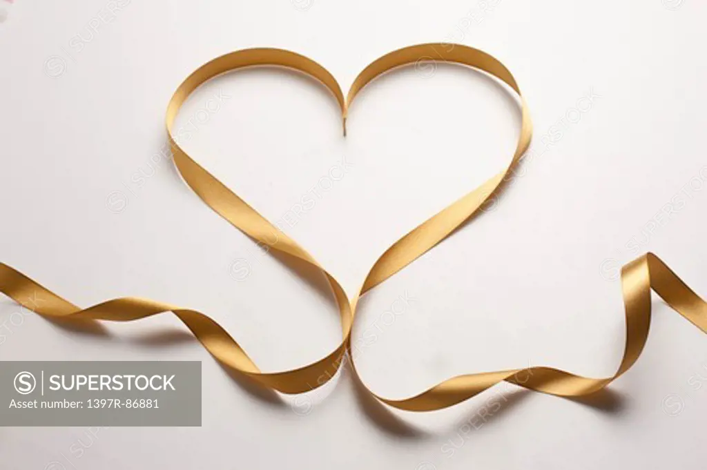 Golden ribbon in heart shape