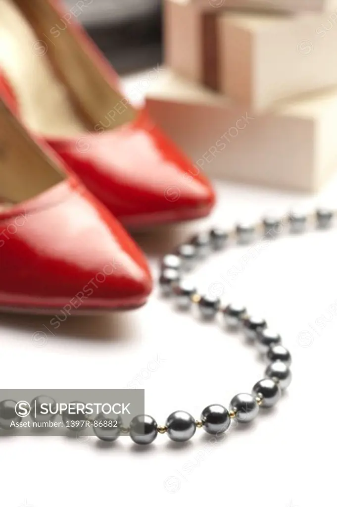 Black pearl necklace and high heels