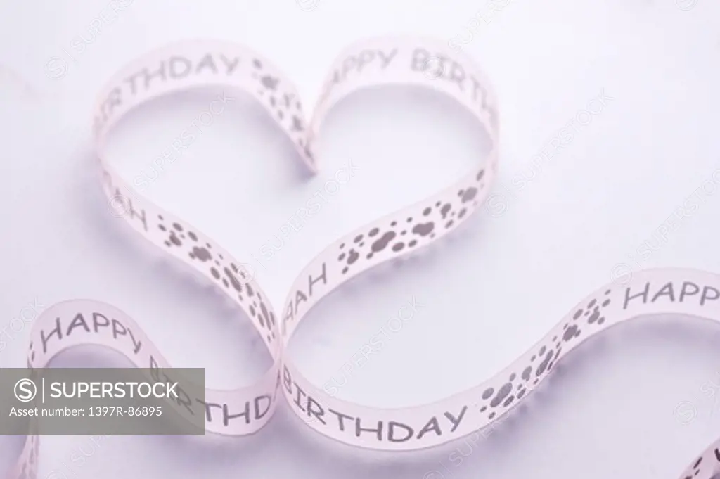 Happy birthday ribbon in heart shape