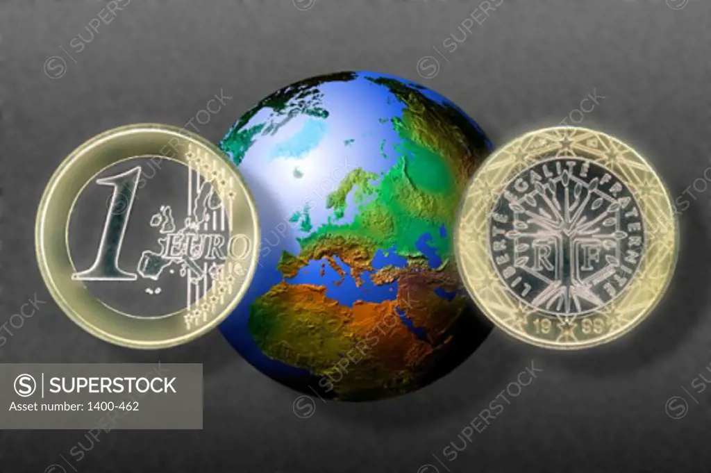 Close-up of two coins in front of a globe