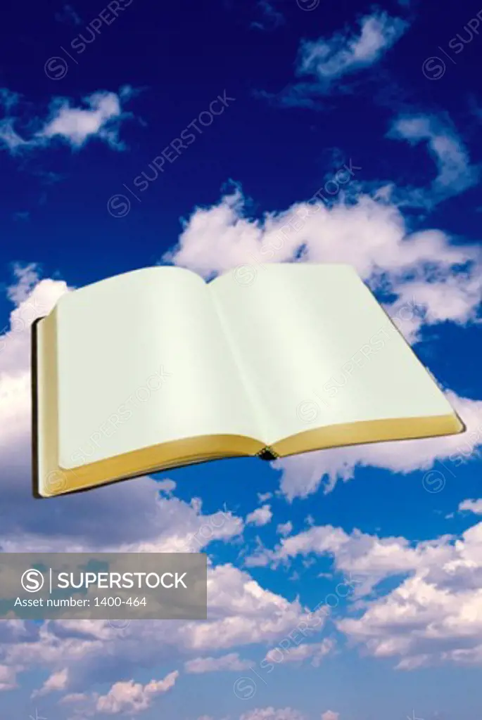 Close-up of an open book floating in the sky