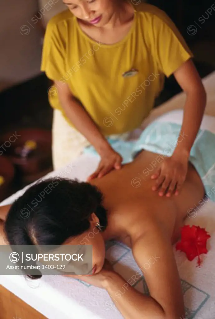 Woman receiving a back massage from a massage therapist, Bali Hyatt, Sanur, Bali, Indonesia