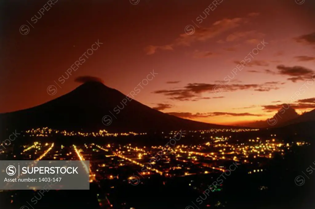 Aerial view of buildings in a city in front of a volcanic mountain, Agua Volcano, Antigua, Guatemala