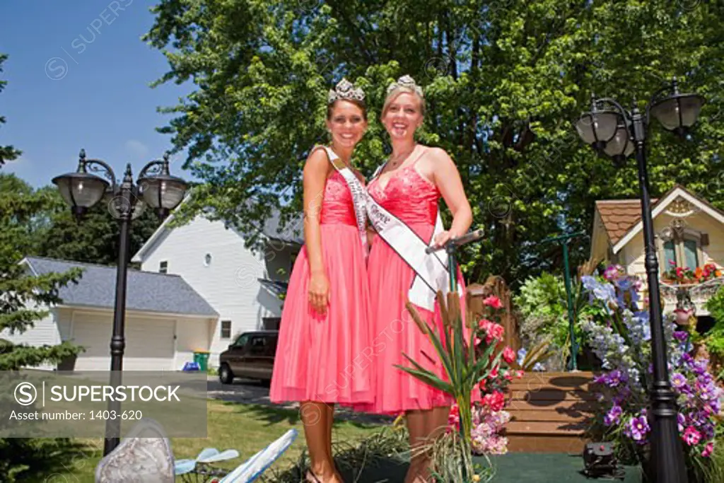 Two young women in costumes in a parade, Grande Day Parade, Hopkins Raspberry Festival, Hopkins, Minnesota, USA