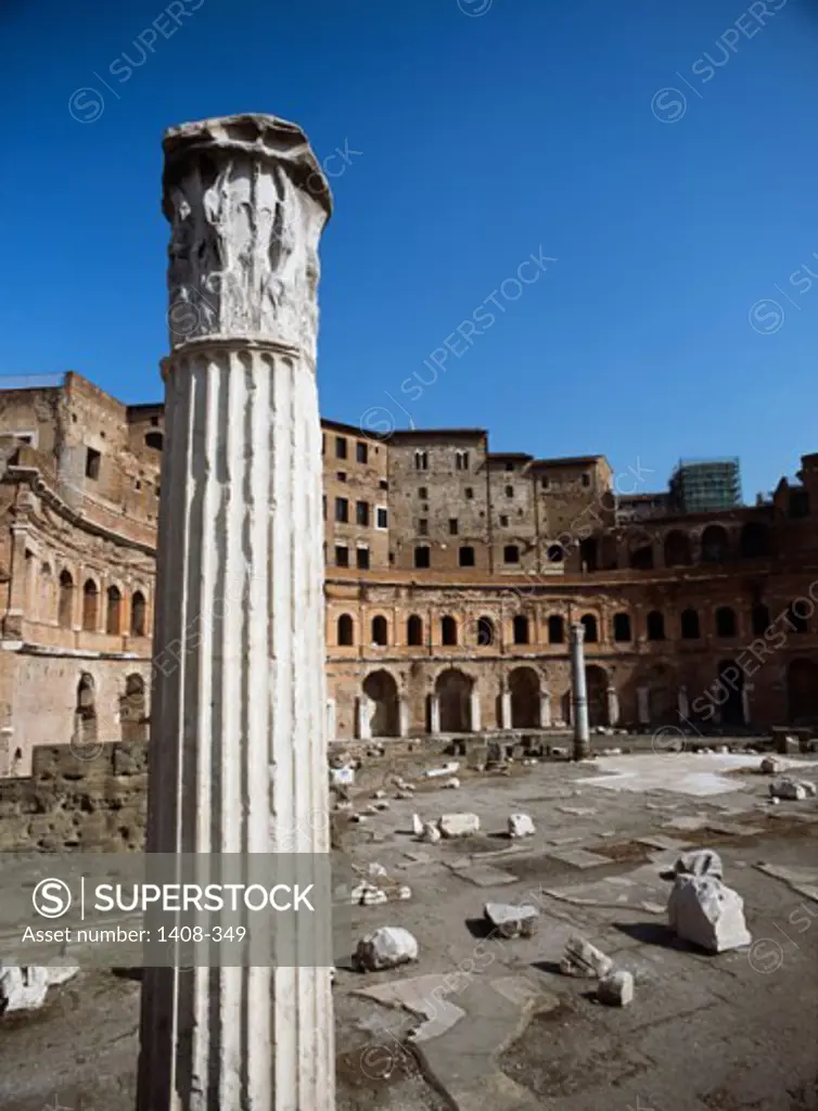 Column in front of the ruins of a building, Trajan's Forum, Rome, Italy