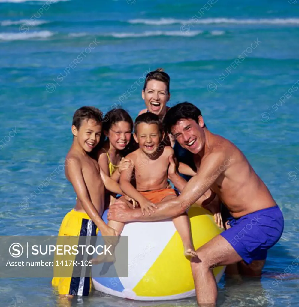 Father and mother with their daughter and sons at the beach